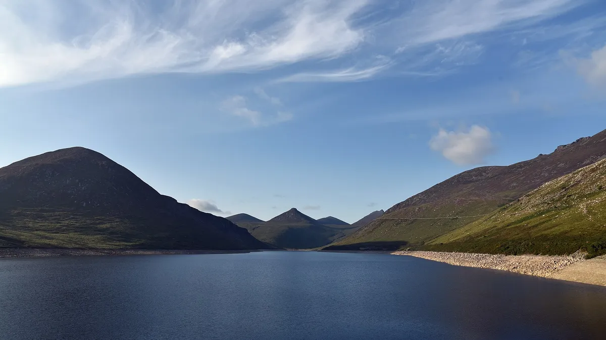 The Silent Valley reservoir with steep Mourne slopes rising on both sides