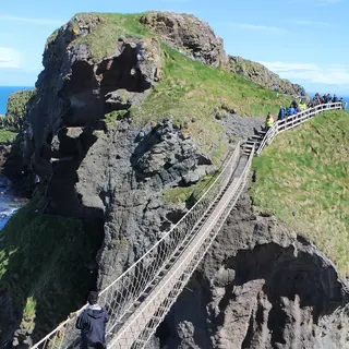 The rope bridge running across to the rocky island of Carrick-a-Rede, with the sea on both sides