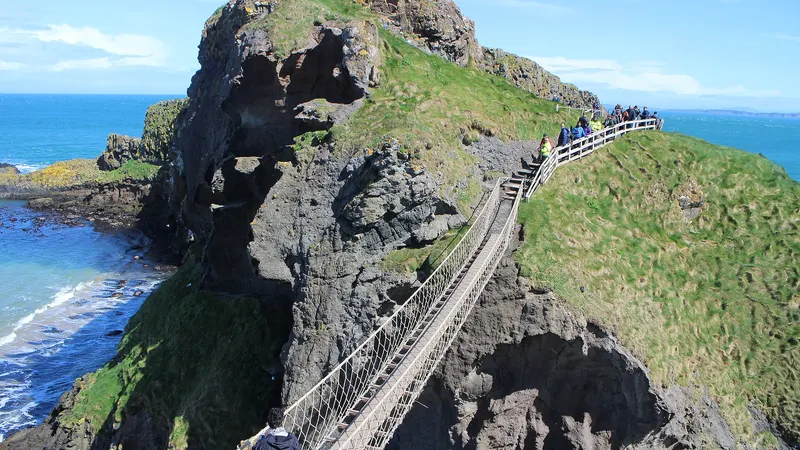 The rope bridge running across to the rocky island of Carrick-a-Rede, with the sea on both sides