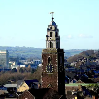 The red and white steeple of St Anne's Church, Shandon, above the city