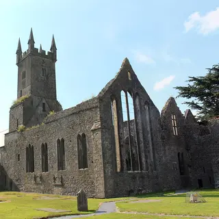 The roofless church, tall windows and tower of Ennis Friary