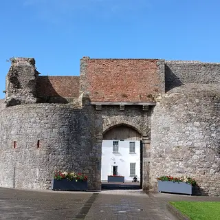 The round towers and gateway of Dungarvan Castle on a sunny day