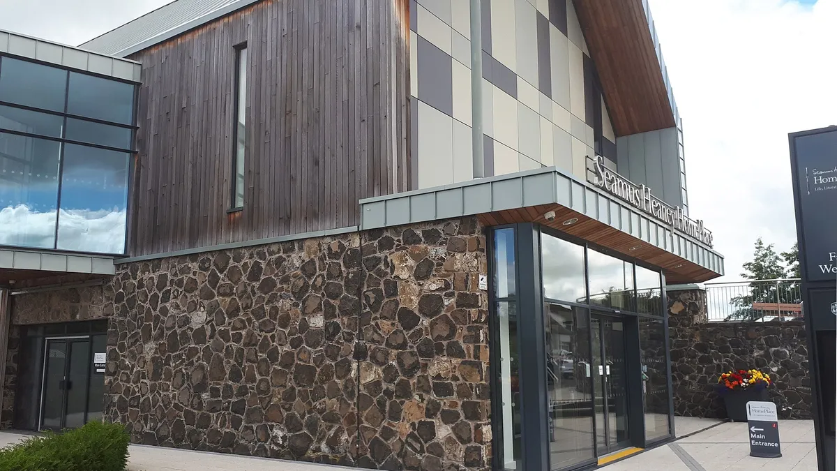 The timber and dark stone front of Seamus Heaney HomePlace in Bellaghy