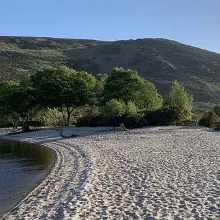 The sandy beach at the head of Lough Dan in the Wicklow Mountains
