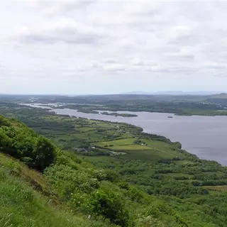 The view from the top of the Magho cliffs down over wooded slopes to Lower Lough Erne