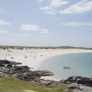 The white sand and clear water of Dog's Bay in Connemara