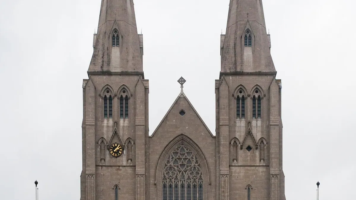 The twin spires of St Patrick's Catholic Cathedral in Armagh above a long flight of steps
