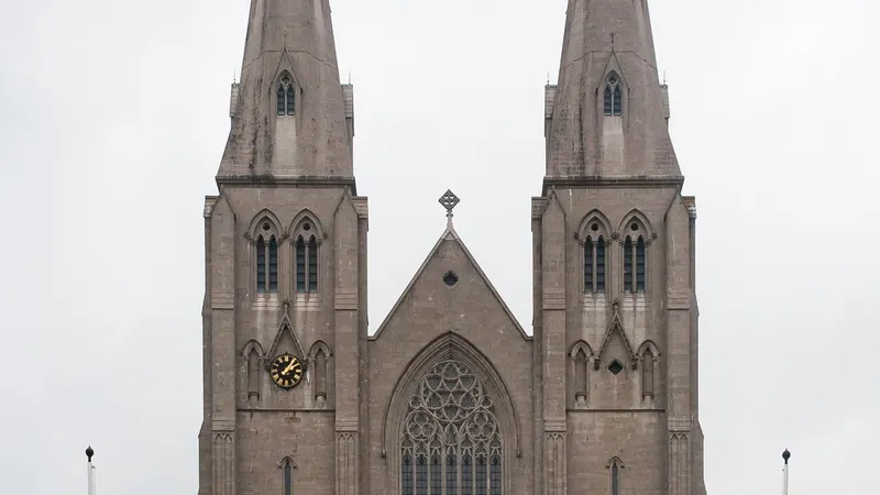 The twin spires of St Patrick's Catholic Cathedral in Armagh above a long flight of steps