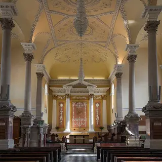 The nave of Christ Church Cathedral in Waterford, its columns and plasterwork leading to the altar