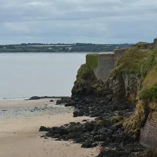 The walls of Duncannon Fort on the rocks above the beach