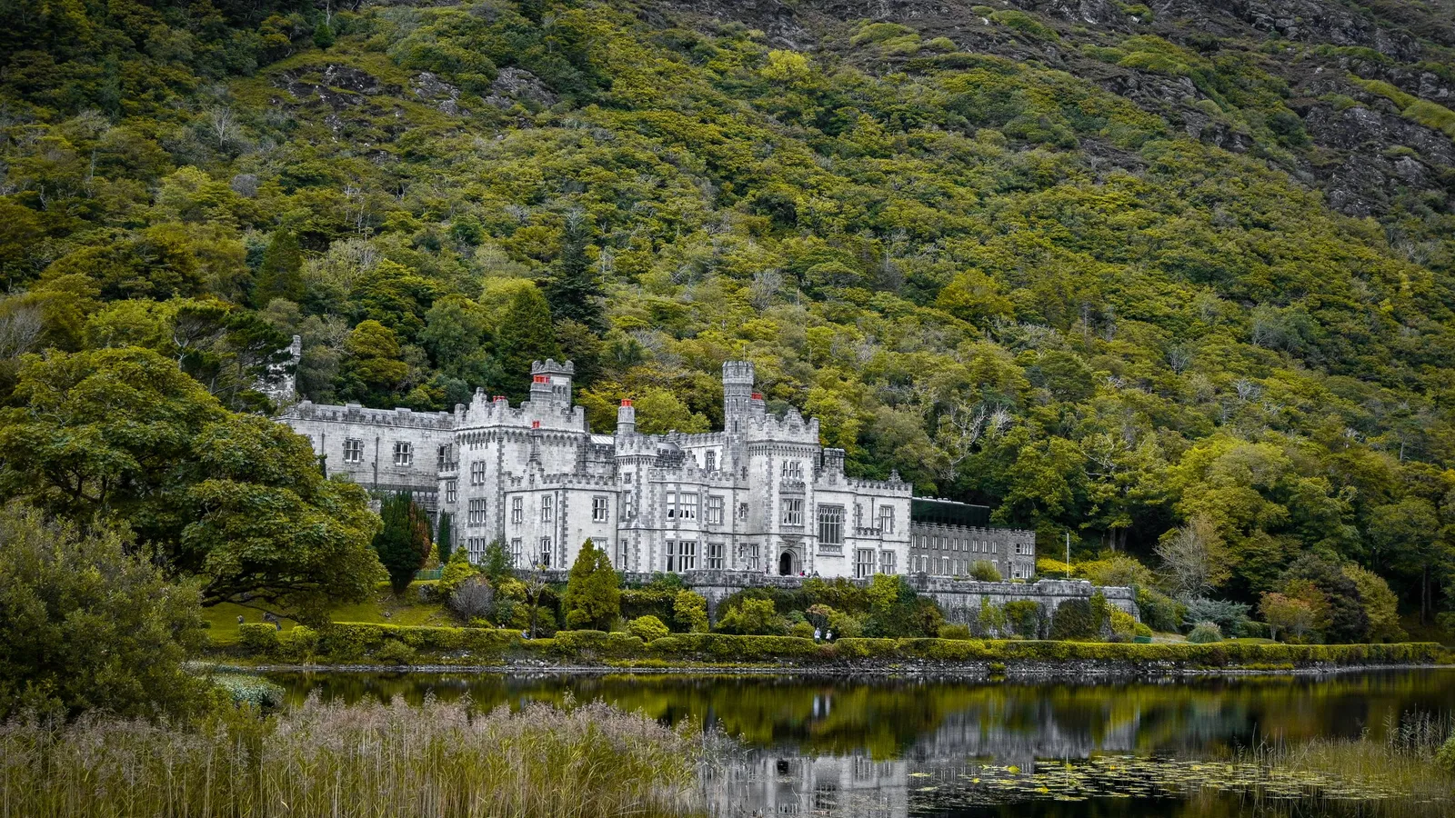 Kylemore Abbey and its reflection in the lake below the mountain