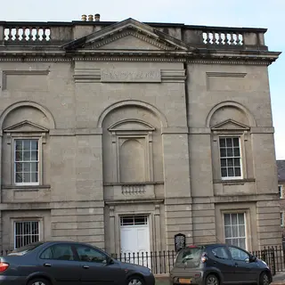 The classical stone front of the Armagh Robinson Library on Abbey Street