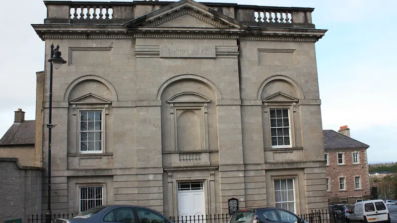 The classical stone front of the Armagh Robinson Library on Abbey Street