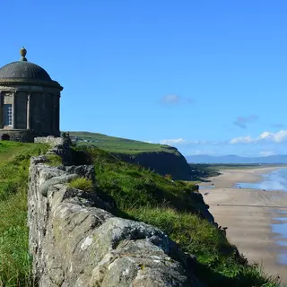 Mussenden Temple on the cliff edge above the long sweep of Downhill beach