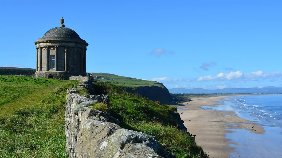Mussenden Temple on the cliff edge above the long sweep of Downhill beach