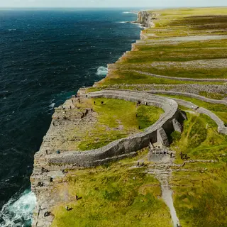 The stone ramparts of Dún Aonghasa on the cliff edge, from the air