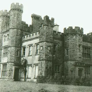 The castellated front of Castle Saunderson in a faded old photograph