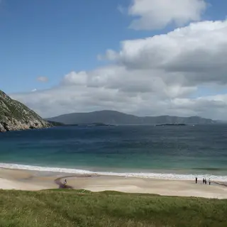 The sandy beach and clear water at Keem Bay below the hills of Achill