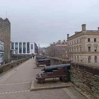 A row of old cannon along the broad walkway on top of the Derry city walls