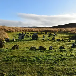 The stone circles and cairns at Beaghmore laid out across open moorland, with low hills behind