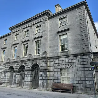 The grey stone front of the Hunt Museum, the old Custom House in Limerick